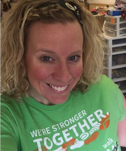woman in green We're Stronger Together tee shirt for MS awareness
