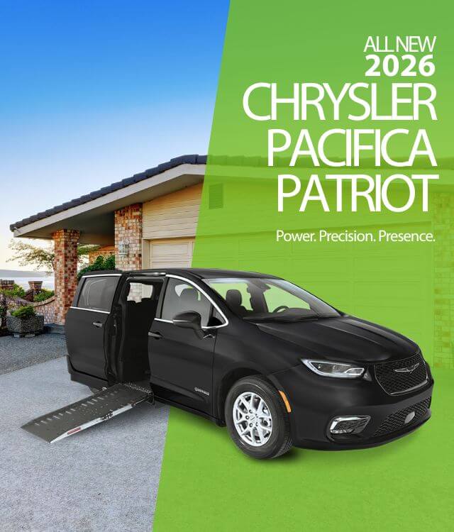 A black 2026 Chrysler Pacifica Patriot minivan with a deployed wheelchair ramp is parked in a driveway in front of a house.