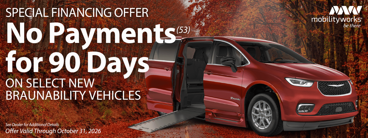 A red BraunAbility accessible van with an extended ramp, with text advertising no payments for 90 days on select new vehicles through October 31, 2026.