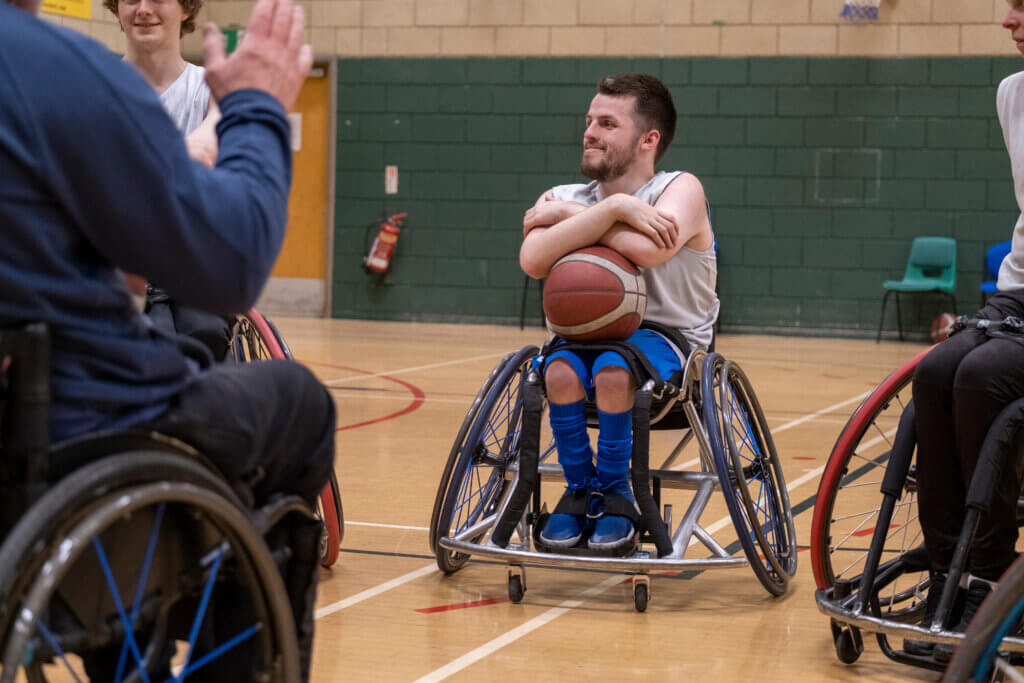 Team of wheelchair basketball players having practice