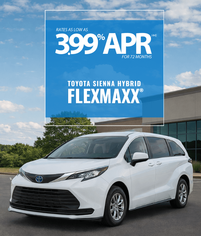 A white Toyota Sienna Hybrid van is parked outdoors in front of a building. Text advertises a 3.99% APR for 72 months on the Toyota Sienna Hybrid FlexMaxx.