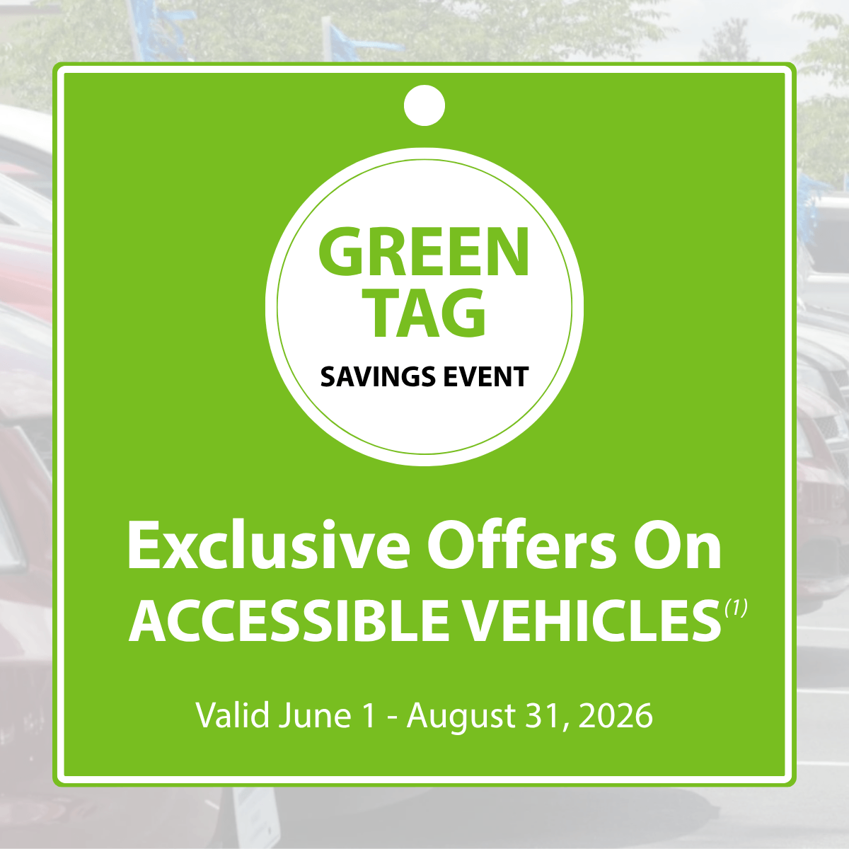 Green Tag Savings Event sign advertising exclusive offers on accessible vehicles, valid June 1 to August 31, 2026, with parked cars visible in the background.