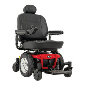A red and black electric power wheelchair with padded seat, headrest, armrests, footrest, and joystick controls.