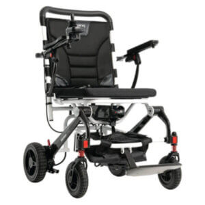 A black and silver motorized wheelchair with padded seat, joystick control on the armrest, and four wheels with suspension.