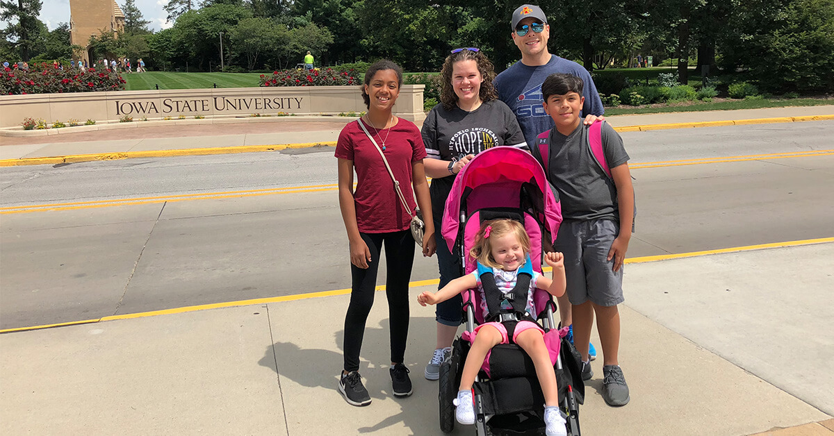 The Garrison family poses for a photo near Iowa State University