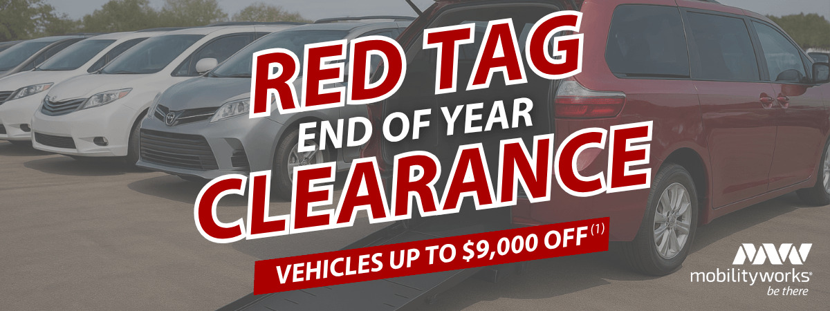 Row of vans in a parking lot with text: Red Tag End of Year Clearance. Vehicles up to $9,000 off. Don’t miss MobilityWorks promotions—logo in the corner.