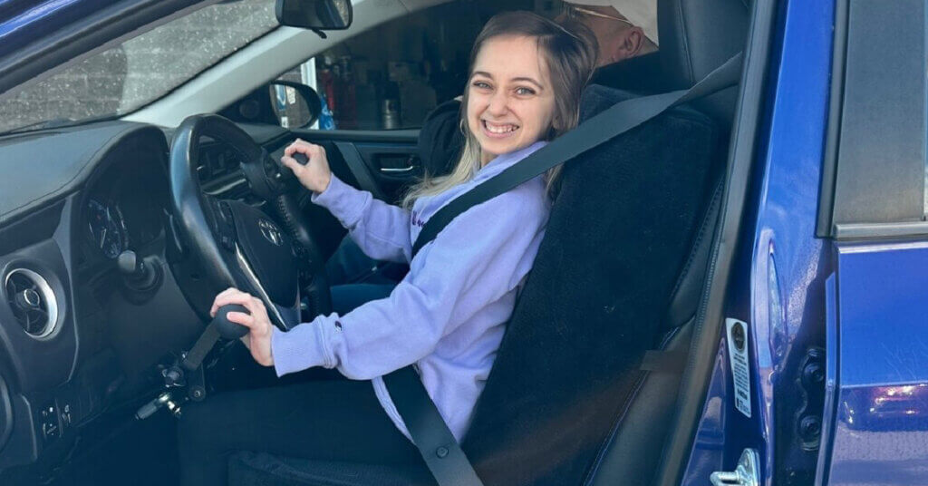 TLC Reality Star Shauna Rae sits in her new MobilityWorks vehicle and smiles at the camera