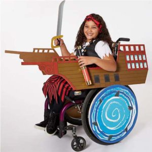 Child in wheelchair dressed in an adaptive pirate-themed costume