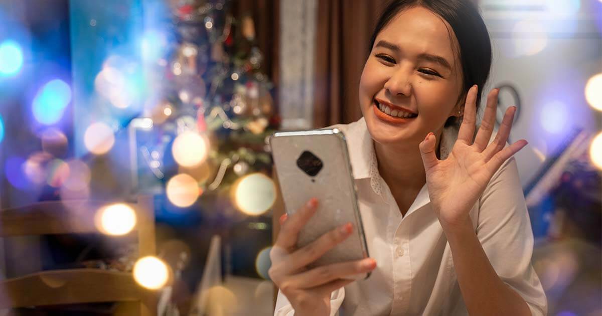 Woman video chats with loved ones during the holidays.
