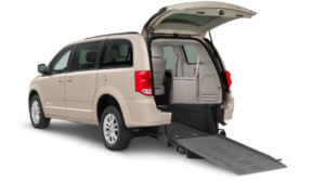 Light brown wheelchair van with rear side entry ramp and rear door open