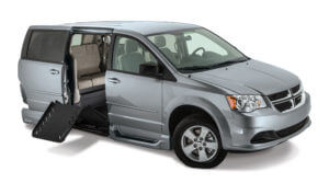 Clean Blue Dodge Summit con rampa para silla de ruedas plegable y asientos traseros aparentes