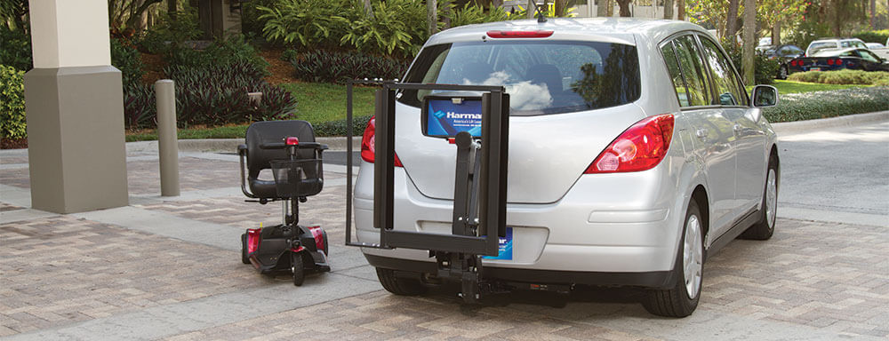 exterior scooter lift on back of silver vehicle