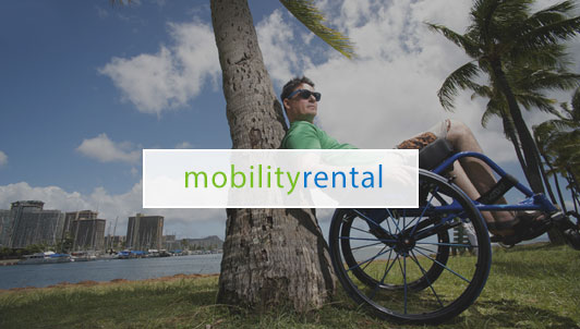 mobility rental - man in wheelchair leaning against tree
