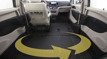 Obstacle free interior of a wheelchair van with yellow cycle symbol on the floor