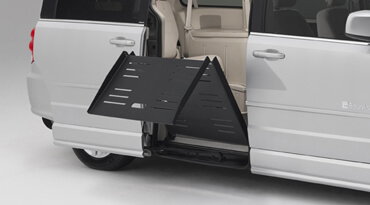Manual ramp on a wheelchair van folding upward
