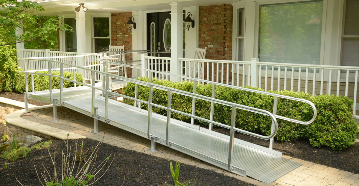 wheelchair ramp coming from front porch of a house