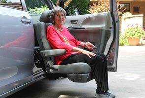 woman getting out of vehicle using a turning seat