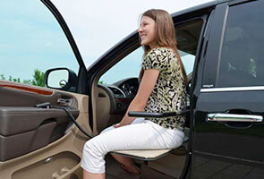 woman using an Adapt XL seat to exit a vehicle